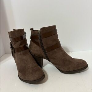 Coach and Four ankle boots, featuring strap accents and a side zipper.